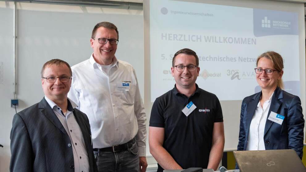 Portraitbild von vier Personen
