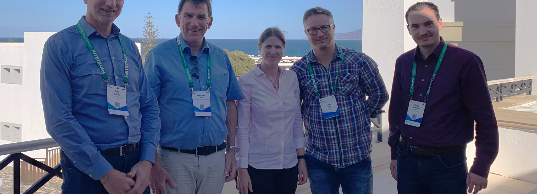 Five people are standing at a viewpoint