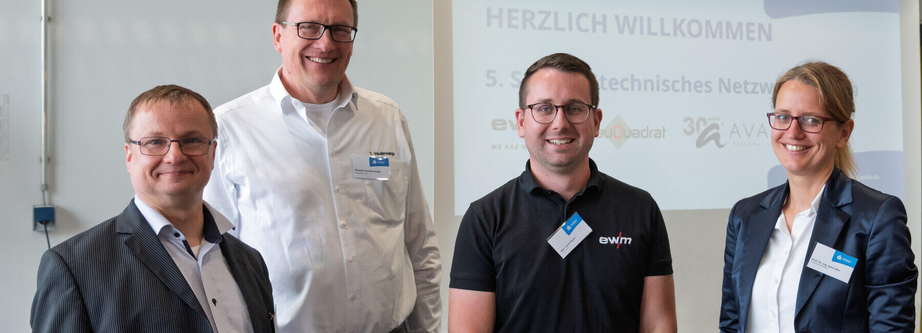 Portraitbild von vier Personen